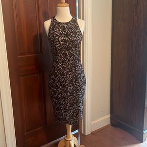 Knee length sheath dress.